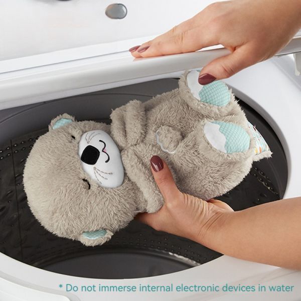 Poupée loutre endormie apaisante